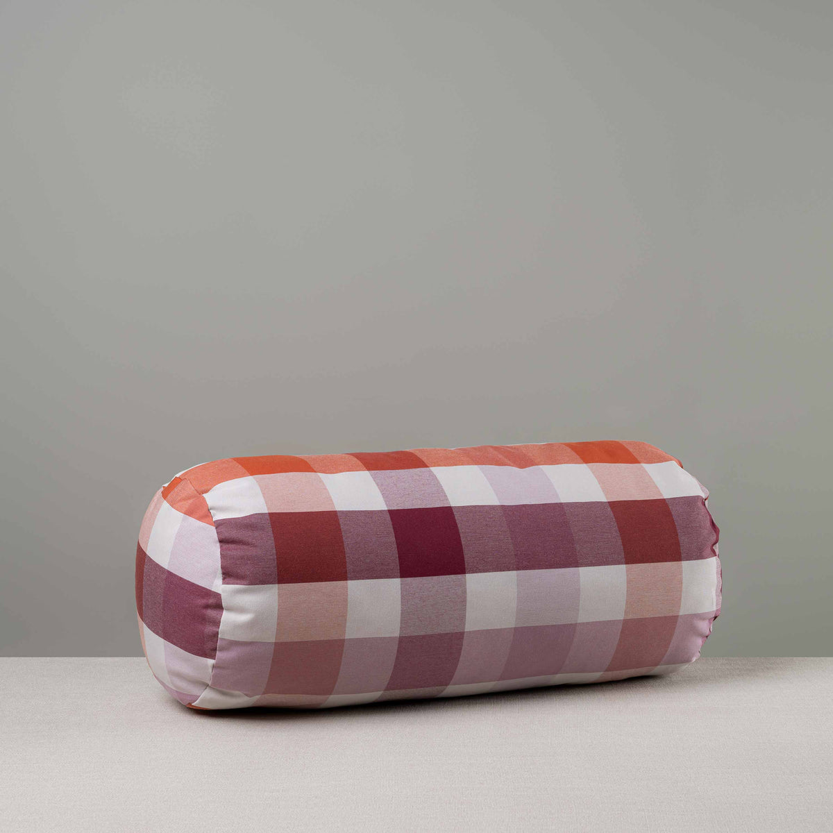Bask Bolster Cushion in Checkmate Cotton, Berry