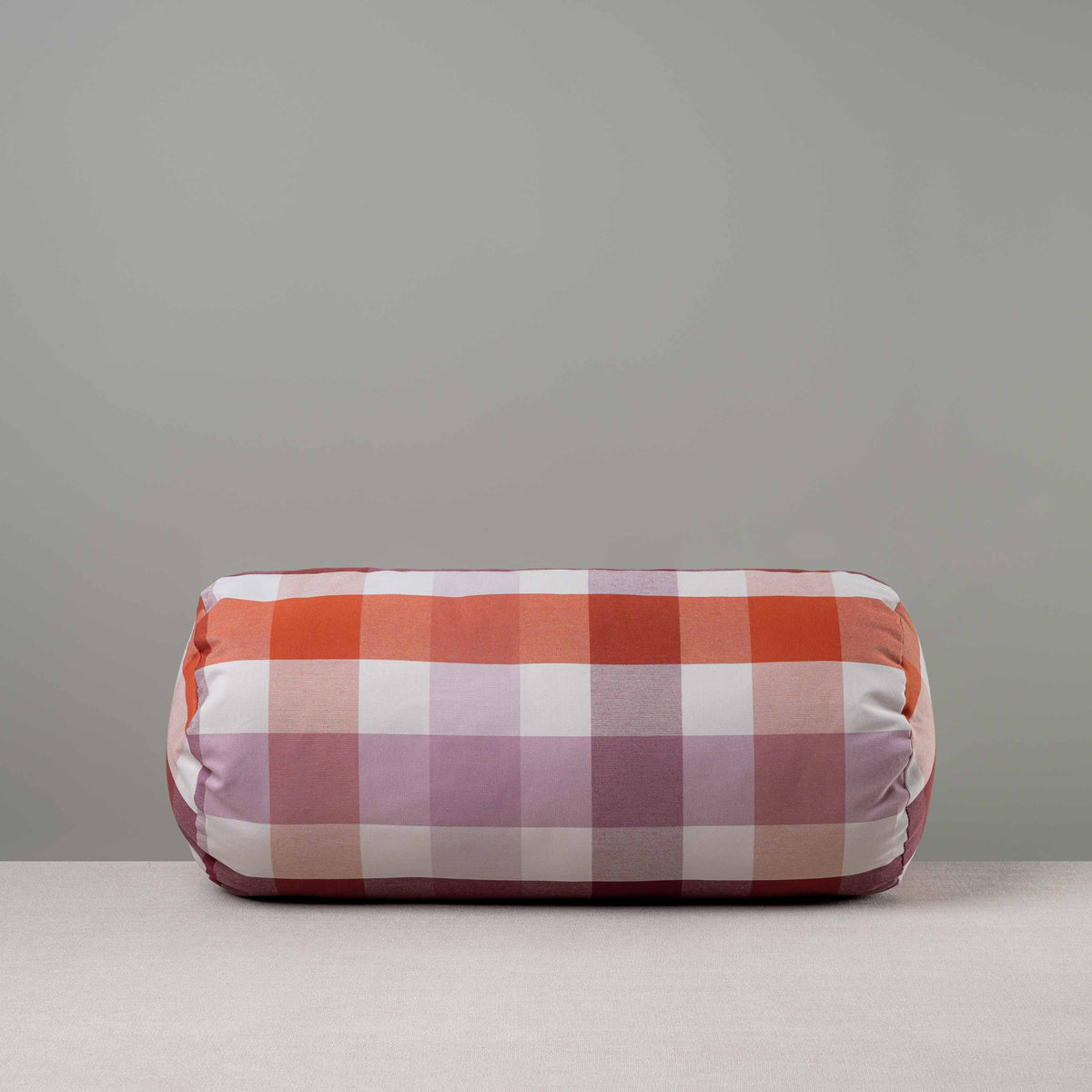 Bask Bolster Cushion in Checkmate Cotton, Berry